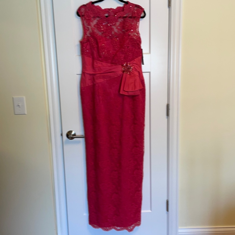 Lace evening gown in a beautiful coral color. Never worn. Bought at Saks.
